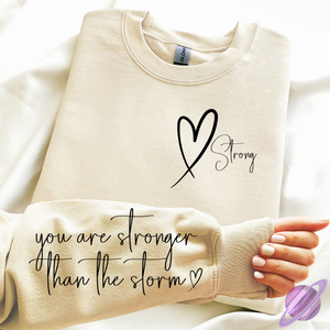 STRONGER THAN THE STORM SWEATSHIRT W/ SLEEVE PRINT